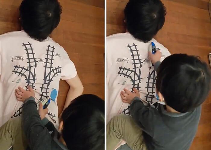Pai cria camiseta para que filho faça uma massagem enquanto brinca - Papo de Pai
